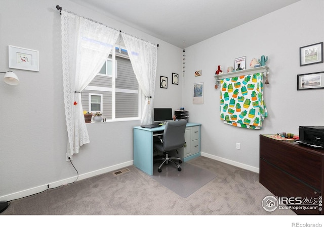 carpeted office space with visible vents and baseboards