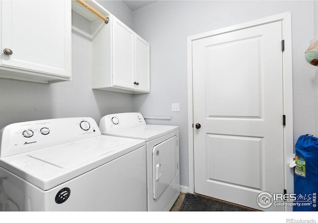 laundry area featuring cabinet space and washing machine and clothes dryer