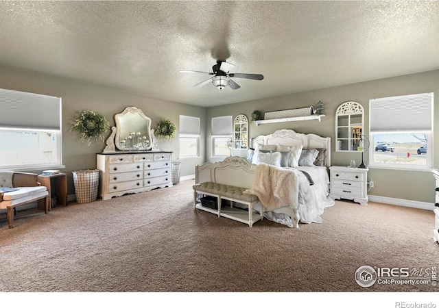bedroom with baseboards, multiple windows, and carpet
