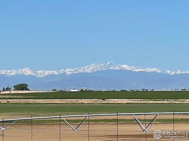 exterior space with a rural view and a mountain view