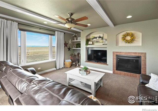 33409 Faith Ln, Eaton, CO 80615 - living area with carpet, a fireplace, a ceiling fan, beamed ceiling, and recessed lighting