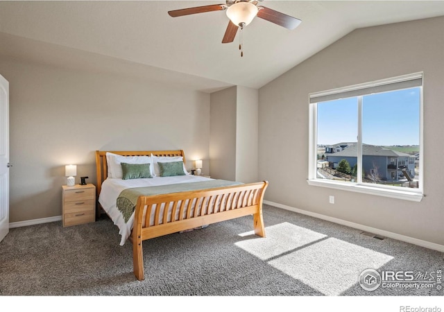 bedroom featuring vaulted ceiling, carpet, baseboards, and ceiling fan