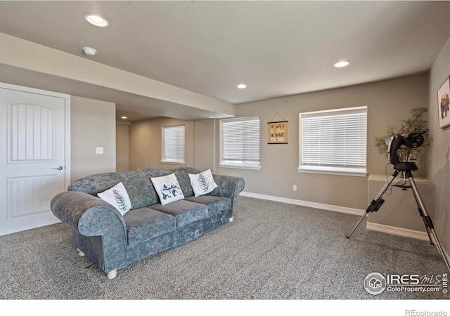 living room with carpet floors, baseboards, and recessed lighting