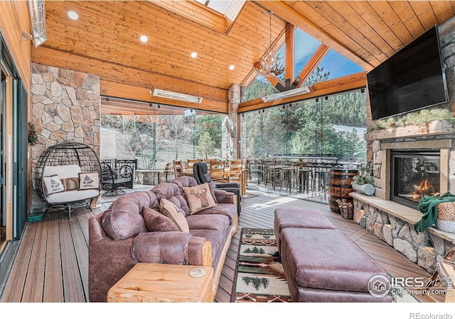 9512 County Road 43, Glen Haven, CO 80532 - living area with a wealth of natural light, high vaulted ceiling, wood ceiling, and an outdoor stone fireplace