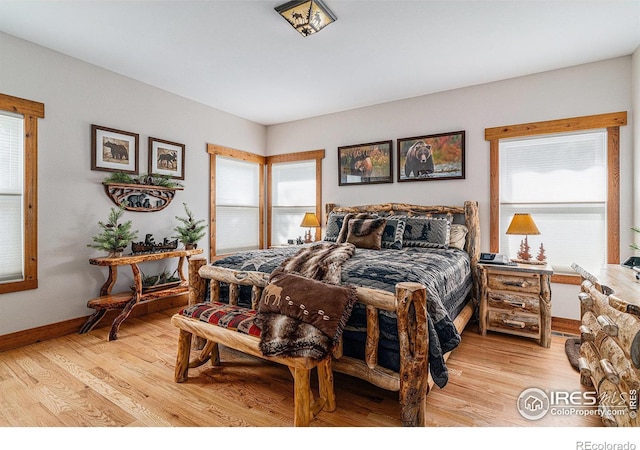 9512 County Road 43, Glen Haven, CO 80532 - bedroom featuring light wood-type flooring and baseboards