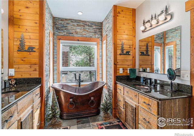 9512 County Road 43, Glen Haven, CO 80532 - bathroom with stone finish flooring, a soaking tub, and vanity