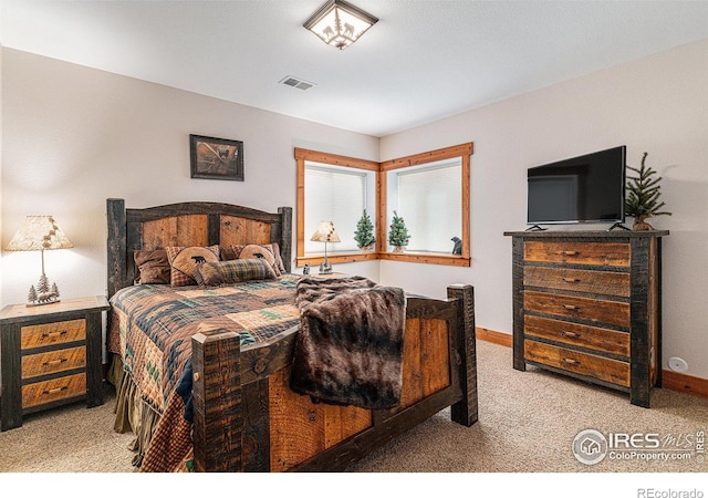 9512 County Road 43, Glen Haven, CO 80532 - carpeted bedroom with baseboards and visible vents