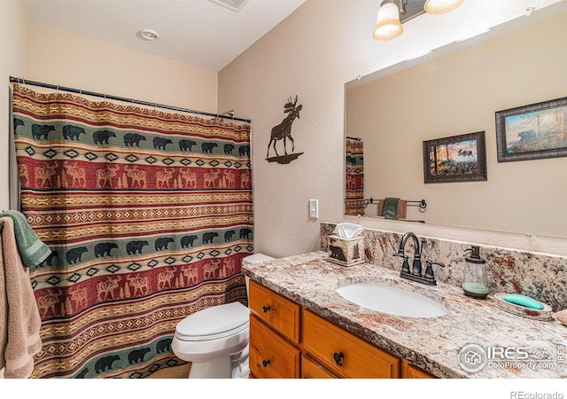 9512 County Road 43, Glen Haven, CO 80532 - full bathroom with a shower with shower curtain, toilet, and vanity