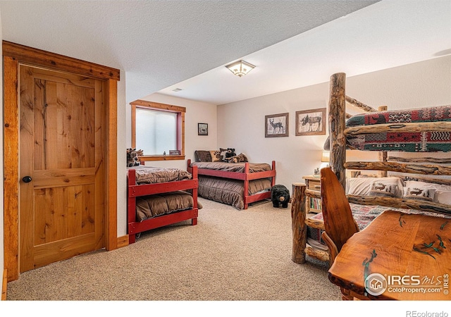 9512 County Road 43, Glen Haven, CO 80532 - carpeted bedroom featuring a textured ceiling