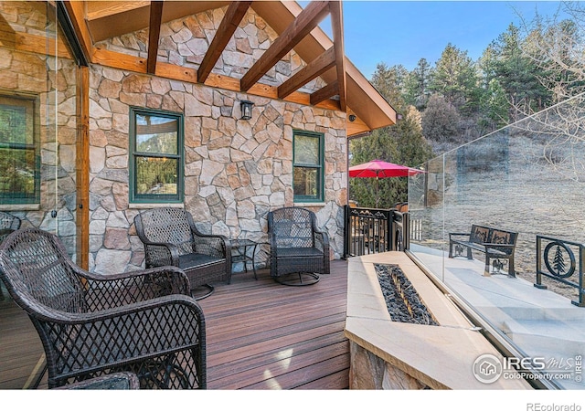 9512 County Road 43, Glen Haven, CO 80532 - deck featuring an outdoor living space with a fire pit