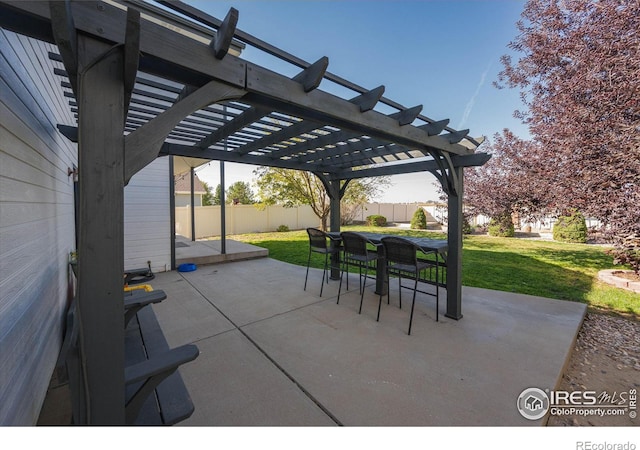 view of patio featuring a pergola, outdoor dining area, and a fenced backyard