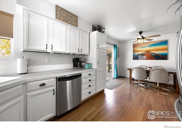 kitchen featuring dark wood-style floors, a ceiling fan, light countertops, white cabinets, and dishwasher