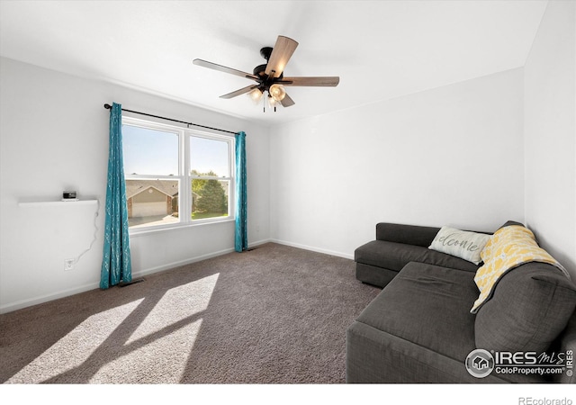 carpeted living area with visible vents, baseboards, and ceiling fan