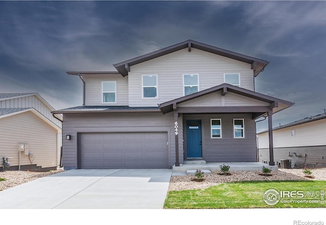 6049 Saddle Horn Dr, Timnath, CO 80547 - view of front of property with an attached garage, a porch, driveway, and central air condition unit