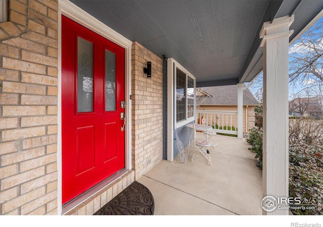 660 Fernglen Ct, Colorado Springs, CO 80906 - doorway to property with a porch and brick siding