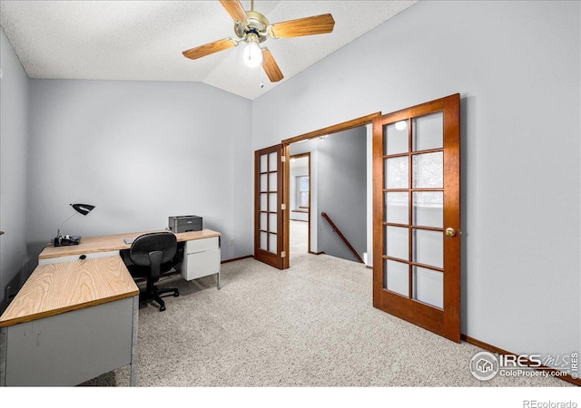 660 Fernglen Ct, Colorado Springs, CO 80906 - carpeted office space featuring french doors, baseboards, a textured ceiling, and vaulted ceiling
