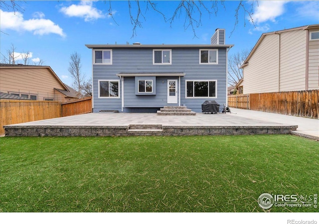 660 Fernglen Ct, Colorado Springs, CO 80906 - rear view of property featuring a patio, a yard, and a fenced backyard