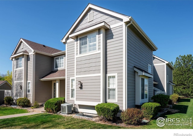 2120 Timber Creek Dr Unit 3, Fort Collins, CO 80528 - view of front of house featuring cooling unit and a front lawn
