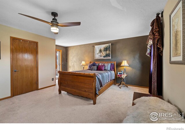 2418 Maplewood Cir E, Longmont, CO 80503 - bedroom with baseboards, a ceiling fan, and carpet