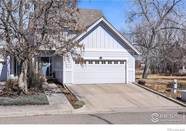 view of front of property with concrete driveway and an attached garage