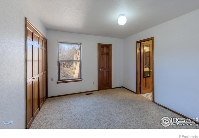 3076 Fulton Cir, Boulder, CO 80301 - unfurnished bedroom with light colored carpet and connected bathroom