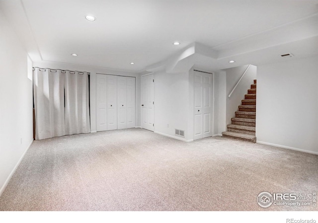 10895 W Half Moon Pass, Littleton, CO 80127 - finished below grade area with stairway, baseboards, recessed lighting, and light colored carpet