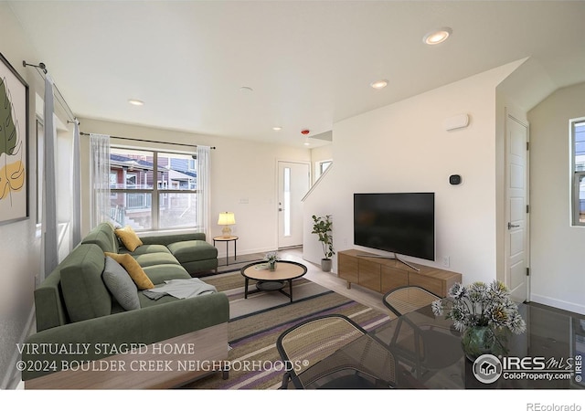 living area with recessed lighting and baseboards