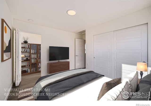bedroom featuring a closet and wood finished floors