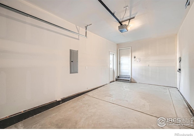 garage with electric panel and a garage door opener