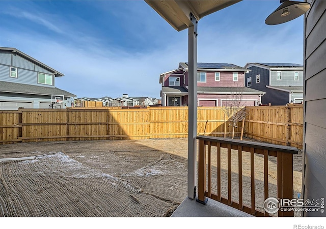 view of yard featuring a residential view and fence