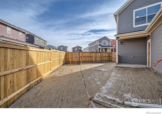 view of yard with a patio and a fenced backyard