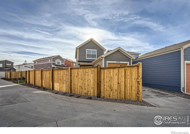 exterior space with a residential view and fence