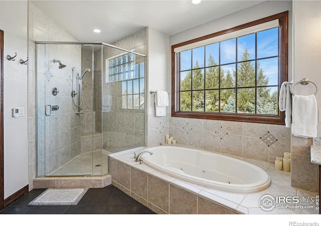 bathroom featuring a shower stall, recessed lighting, a tub with jets, and tile patterned floors
