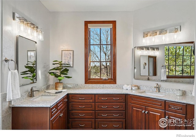 bathroom featuring double vanity and a sink