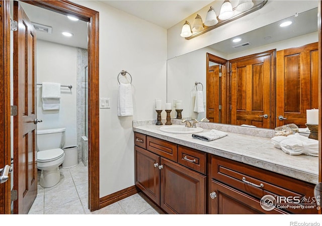 full bathroom featuring tile patterned flooring, visible vents, toilet, and vanity