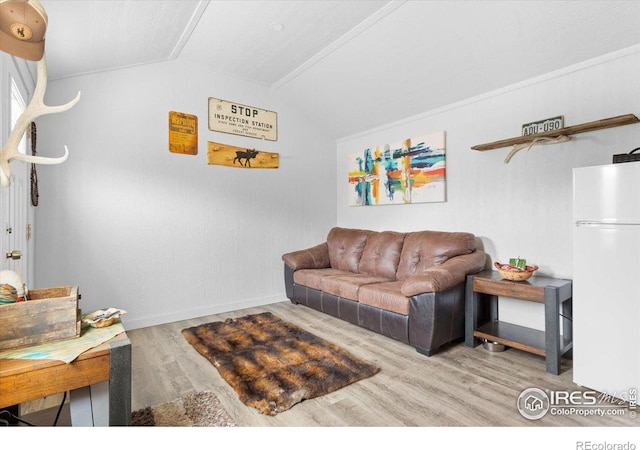 59 W Rustic Rd, Bellvue, CO 80512 - living room with lofted ceiling, wood finished floors, and baseboards