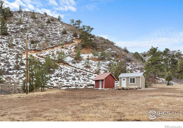 59 W Rustic Rd, Bellvue, CO 80512 - view of yard with an outbuilding, a mountain view, and a shed