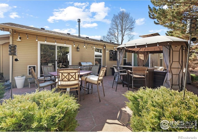 5621 W 27th St, Greeley, CO 80634 - view of patio / terrace with a gazebo and outdoor dining area