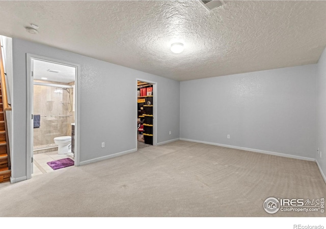 5621 W 27th St, Greeley, CO 80634 - unfurnished bedroom featuring baseboards, visible vents, a spacious closet, a closet, and carpet flooring