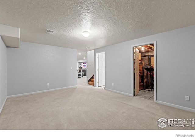 5621 W 27th St, Greeley, CO 80634 - interior space with visible vents, a textured ceiling, recessed lighting, baseboards, and stairs