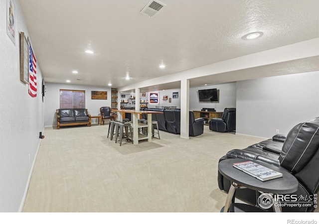 5621 W 27th St, Greeley, CO 80634 - living area featuring recessed lighting, visible vents, light colored carpet, and baseboards