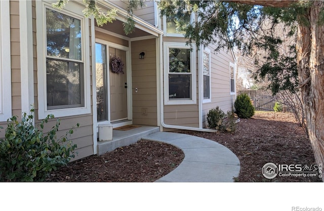 property entrance with fence