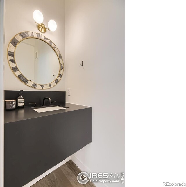 1580 Moss Rock Pl, Boulder, CO 80304 - bathroom featuring a sink and wood finished floors