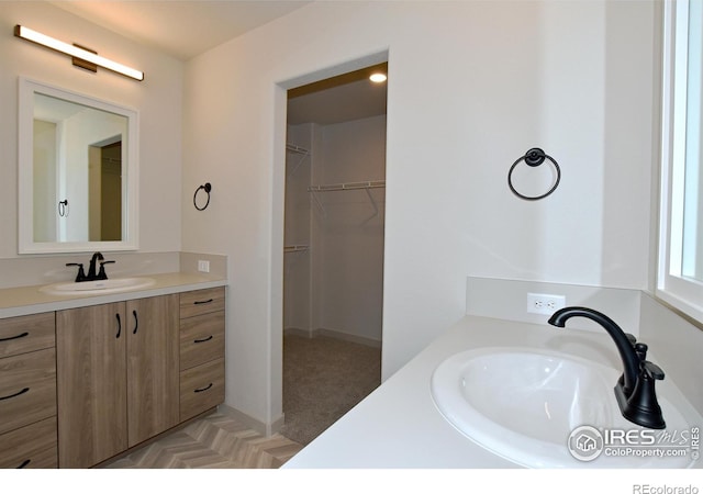 1047 Spartan Ave, Berthoud, CO 80513 - bathroom with a spacious closet and vanity
