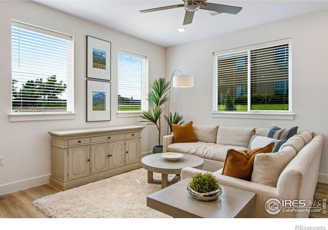 living area featuring recessed lighting, light wood-type flooring, baseboards, and ceiling fan
