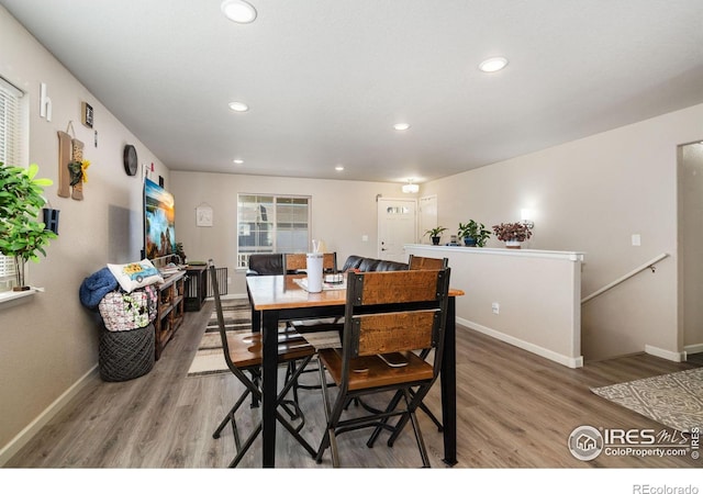 dining area with recessed lighting, baseboards, and light wood-type flooring