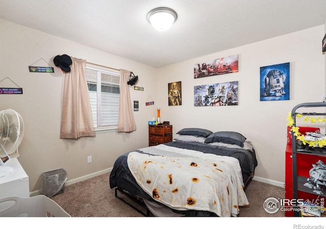 carpeted bedroom featuring baseboards