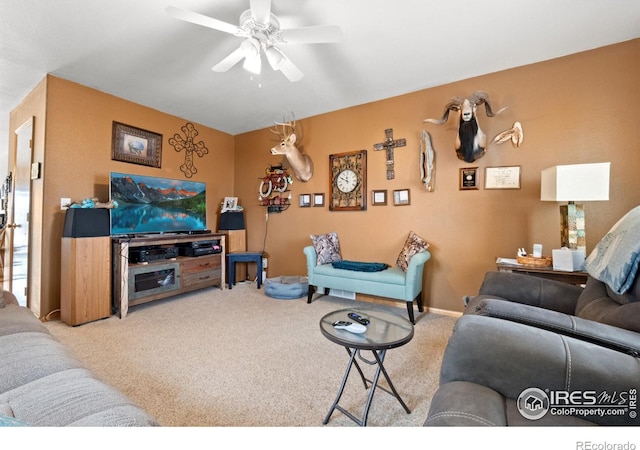562 E St, Hillrose, CO 80733 - living room featuring carpet flooring and a ceiling fan