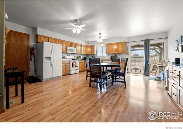 562 E St, Hillrose, CO 80733 - dining area featuring light wood-style flooring and a ceiling fan