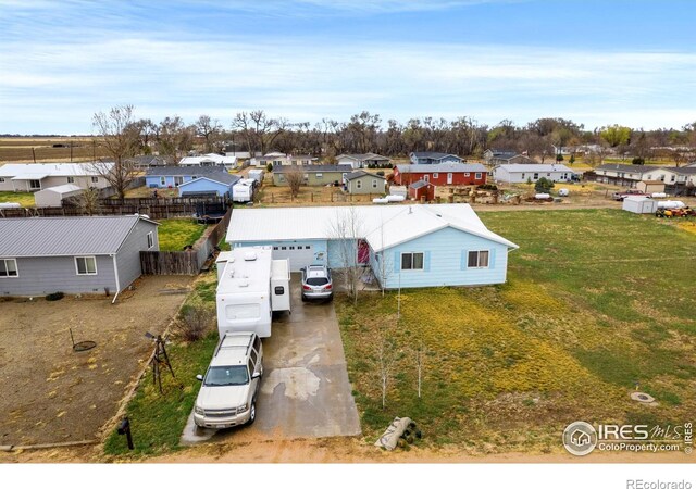 562 E St, Hillrose, CO 80733 - drone / aerial view with a residential view